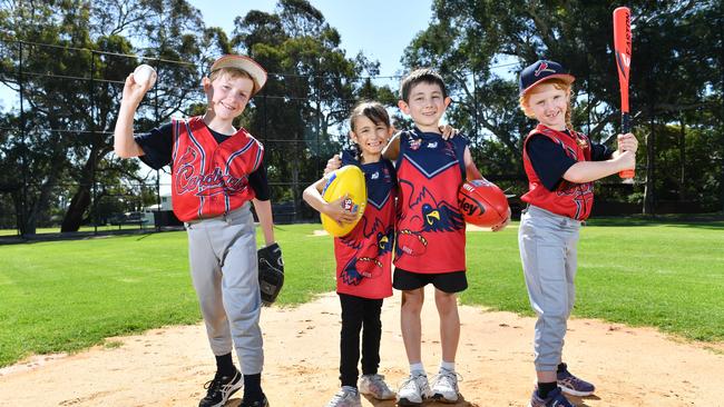 Kensington Cardinals baseball and footballers Ethan Walpole, Victoria Barreto, Samuel Barreto and Abby Bain. The Baseball Club has established junior girls and junior boys football teams for 2020. Picture: AAP/ Keryn Stevens