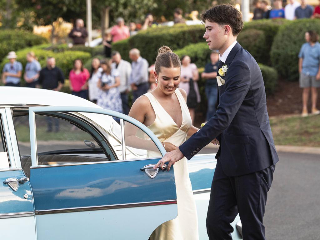 Graduates Charli Botham and Charlie Crawford arrive at Mary MacKillop Catholic College formal at Highfields Cultural Centre, Thursday, November 14, 2024. Picture: Kevin Farmer