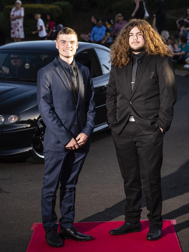 Blair Garland (left) and Tristan Wilson arrive at Harristown State High School formal at Highfields Cultural Centre, Friday, November 18, 2022. Picture: Kevin Farmer