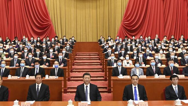 Xi Jinping, center, attends the opening session of the Chinese People's Political Consultative Conference (CPPCC) at the Great Hall of the People in Beijing. Picture: AP.