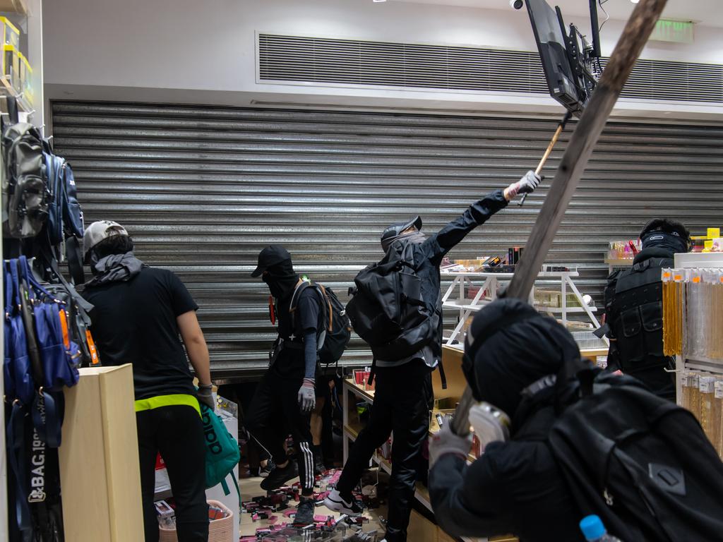 Demonstrators vandalised a MINISO shop during a pro-democracy march at Mongkok district in Hong Kong, China. Picture: Getty Images