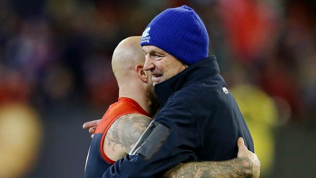 Neale Daniher and Nathan Jones hug after a game. Picture: Michael Klein