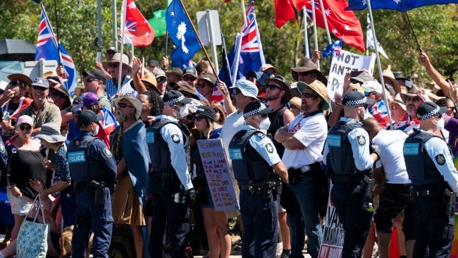 Police are seen standing in front of the crowd of protesters on Saturday. Picture : NCA NewsWire / Martin Ollman