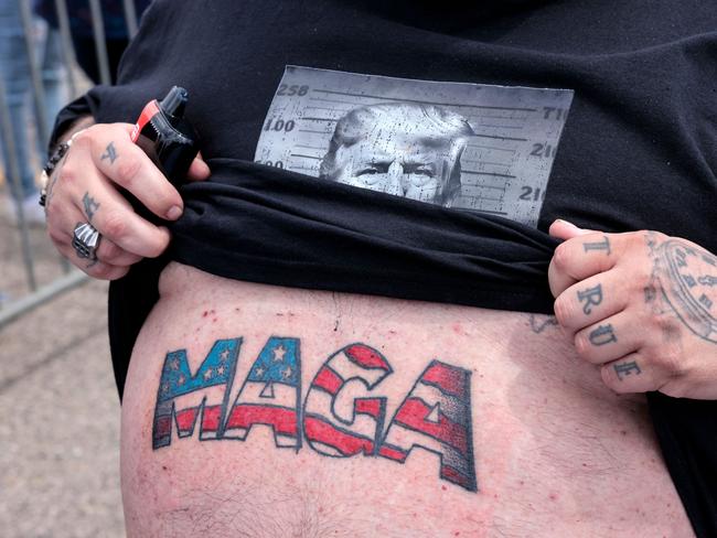 Casey Boeling shows his recently completed tattoo while waiting in line for an event with US President Donald Trump to commemorate his 100th Day in office in Warren, Michigan, on April 29, 2025. Picture: AFP