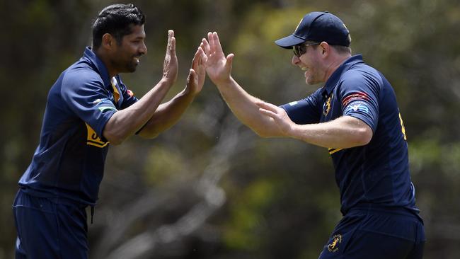 Strathmore’s Chanaka Welegedara and John Bassi celebrate a wicket. Picture: Andy Brownbill