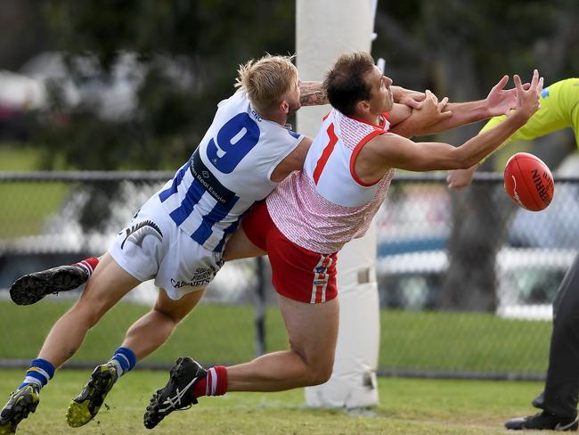 Karingal’s Luke Van Raay (right) attempts a mark against his Langwarrin opponent Shane Paterson in Round 5 this season. Picture: Andy Brownbill