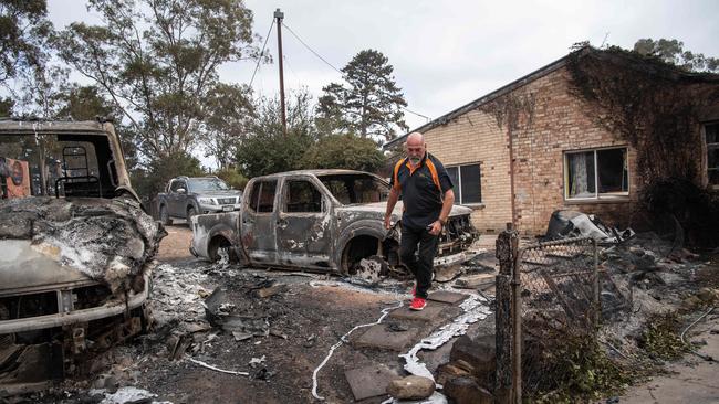 Stuart Temby at his damaged property on Harrogate Rd. Picture: Brad Fleet