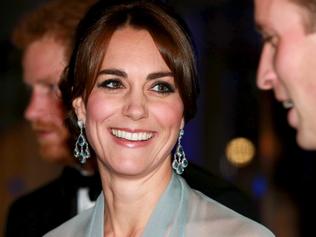 Prince Harry (L), Catherine, Duchess of Cambridge (C) and Prince William, Duke of Cambridge (R) attend The Cinema and Television Benevolent Fund's Royal Film Performance 2015 of the new James Bond 007 film "Spectre" at Royal Albert Hall on October 26, 2015 in London, England.REUTERS/Chris Jackson/Pool