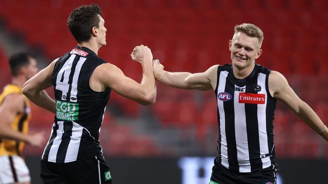 Collingwood's Brody Mihocek celebrates his goal with Adam Treloar during the AFL match between Collingwood and Hawthorn at Giants Stadium on July 10th 2020, Sydney. Picture. Phil Hillyard