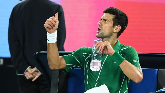 Novak Djokovic has words with the chair umpire. Picture: Saeed Khan/AFP