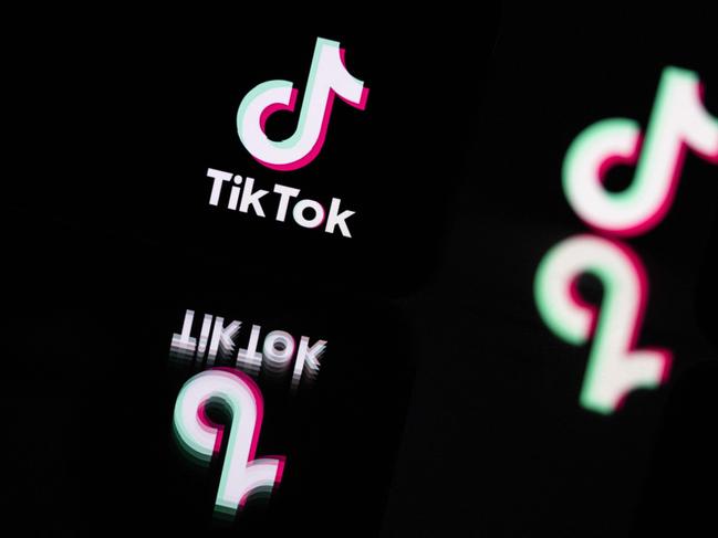 (FILES) This photograph taken in Mulhouse, eastern France on October 19, 2023, shows the logo of the social media video sharing app Tik Tok reflected in mirrors. British telecommunications regulator Ofcom said on July 24, 2024, it had handed video sharing platform TikTok a Â£1.9 million ($2.4 million) fine for failing to timely make available safety data. (Photo by SEBASTIEN BOZON / AFP)