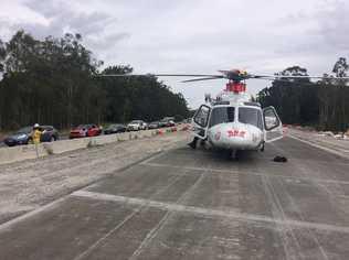 AIRLIFTED: The Westpac Life Saver Rescue Helicopter on the scene of a two-vehicle crash on the Pacific Highway at Mororo. Picture: Westpac Rescue Helicopter