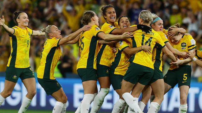 Matildas players celebrate winning the FIFA Womens World Cup Quarter final match between against France at Brisbane Stadium. Picture Lachie Millard