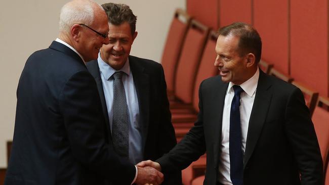 Tony Abbott congratulates Jim Molan after the retired major general’s maiden speech in the Senate Chamber.