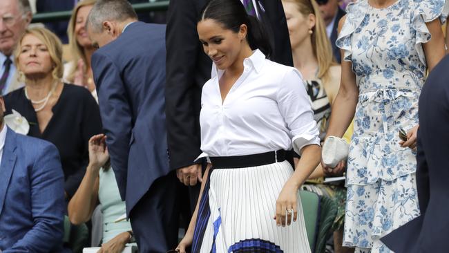 Meghan appeared comfortable and confident when she attended the Wimbledon finals in an elastic-waisted skirt. Picture: Ben Curtis/Getty