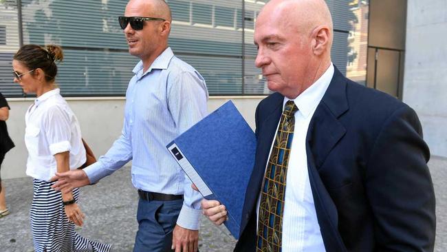 Former Queensland Labor minister Gordon Nuttall (right) leaves the supreme court in Brisbane with son Andrew (c) and daughter Lisa (l), Thursday, Feb. 8, 2017. Nuttall , currently on parole after being convicted for corruption, is attempting to stop the Queensland government from taking his superannuation.(AAP Image/Dave Hunt) NO ARCHIVING. Picture: DAVE HUNT