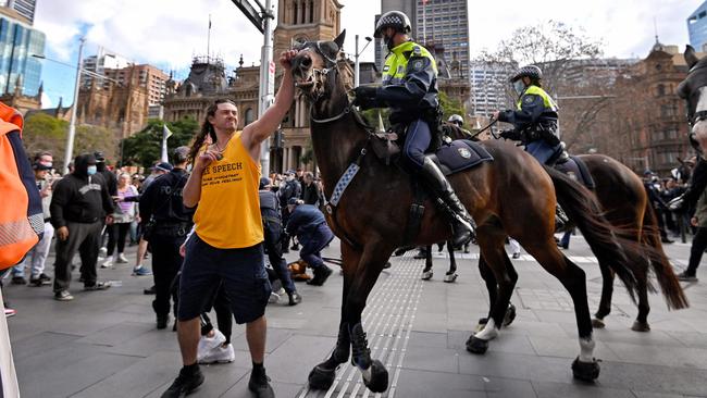 A protester was charged after allegedly striking a police horse in the Sydney rallies. Picture: AFP