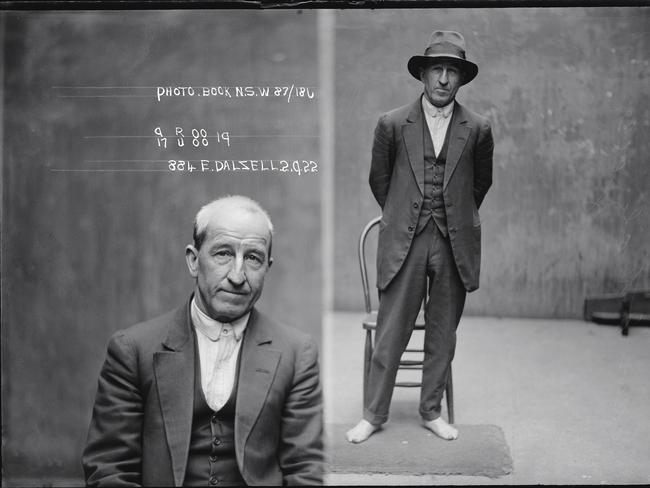 Master safebreaker Edward Dalzell, photographed 2 September 1922. Dalzell was hauled into the police station barefoot suspected of breaking and entering. Police kindly provided a doormat to stop his feet getting cold.