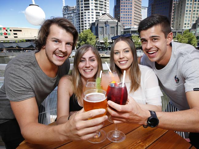 Australians will have to slash their alcohol consumption by four drinks per week to fit within stringent new guidelines issued by the nationÕs peak medical body today. Previously the safe drinking guidelines allowed up to 14 drinks per week that will be lowered to just 10 drinks under the proposed new guidelines. Enjoying a drink by the Yarra River at the Arbory Bar are David Fehringer 27 Melbourne, Steph Gozdawa 32 Melbourne, Sarah Marshall 25 Toorak and Ben Davies 26 Altona.       Picture: David Caird