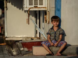 A Syrian child sits at a refugee camp in Turkey.  Picture: AFP