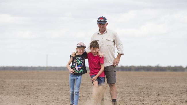 Simon Fagan and his children James, 10, and Felicity, 8, on their property near Coonamble, NSW, which is currently in a state of severe drought. Picture: Dylan Robinson