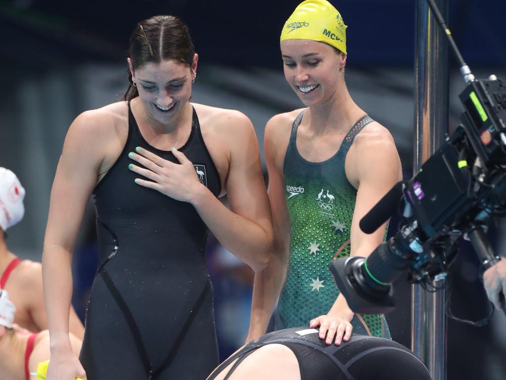 Bronte Campbell congratulates her sister Cate Campbell with team mates Meg Harris and Emma Mckeon after the Australian women’s gold medal world record in the 4 x 100m Freestyle Relay. Picture: Tim Clayton/Corbis via Getty Images