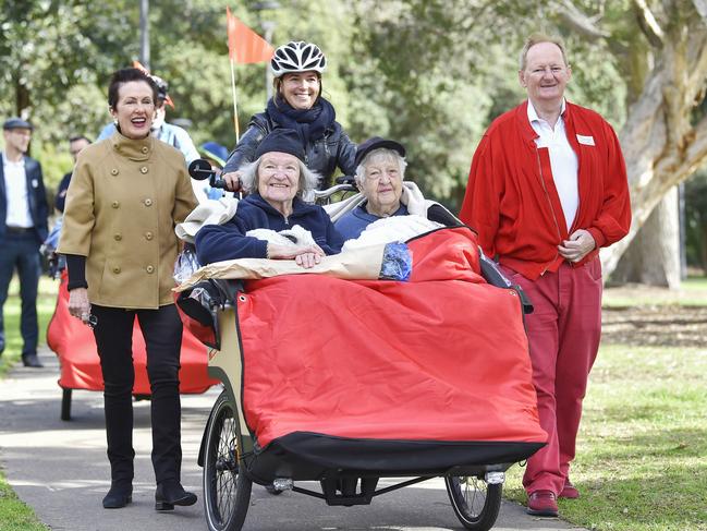 Lord Mayor Clover Moore and Woollahra Mayor Peter Cavanagh walk alongside the ‘trishaw’. Picture: City of Sydney