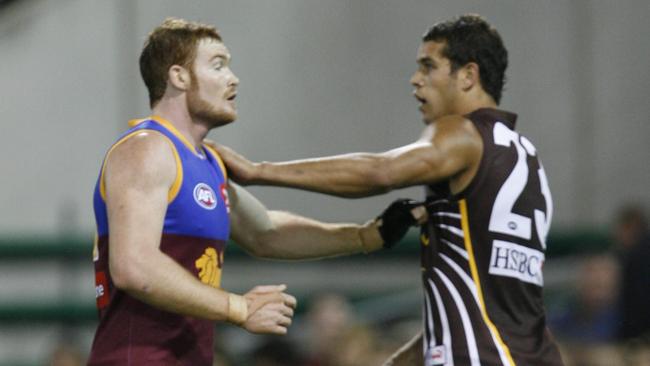 Daniel Merrett stands Hawthorn superstar Lance Franklin.