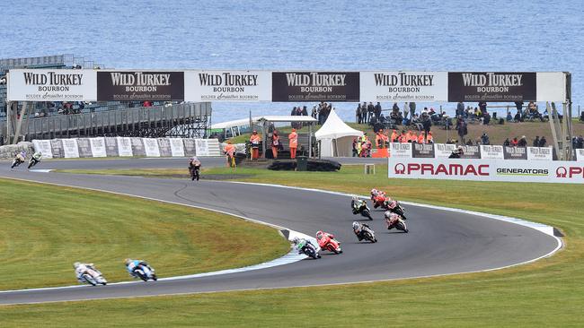 Moto3 riders tip into the Hayshed turn.