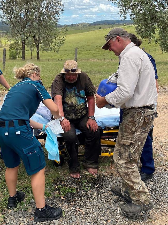 Paramedics giving medical treatment to Robert Weber after he was found by Gympie MP Tony Perrett and Perrett’s wife Michele. Picture: Queensland Police Service/AFP