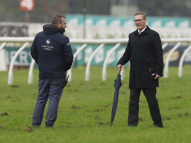 SYDNEY, AUSTRALIA - JULY 02: Track Manager Shaun Patterson (L), and Chief Steward Marc Van Gestel check the track after heavy rain during Sydney Racing at Rosehill Gardens on July 02, 2022 in Sydney, Australia. (Photo by Mark Evans/Getty Images)