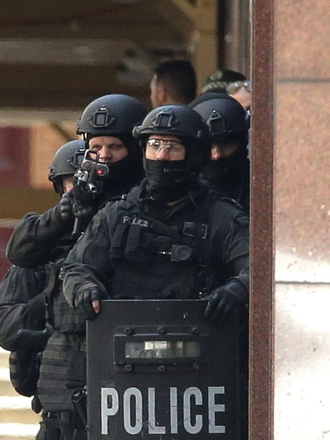 Armed police waiting to storm the cafe to end the 17-hour siege. Picture: Getty Images