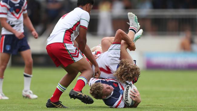 Central Coast Roosters player Jake Herring upended against the Monaro Colts in round one of the Laurie Daley Cup. Picture: Sue Graham