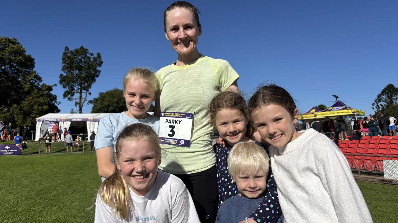 Kathryn Parkinson celebrates winning the Toowoomba Wellcamp Airport Marathon with her children