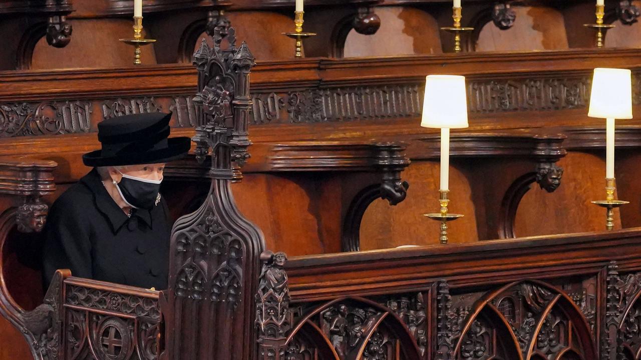 Queen Elizabeth II sits alone for the funeral service of her husband Prince Philip, Duke of Edinburgh, inside St George's Chapel in Windsor Castle last year. Picture: Jonathan Brady / POOL / AFP