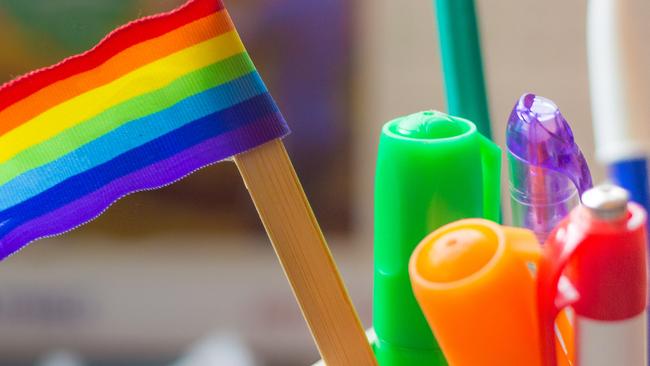 rainbow flag on a desk
