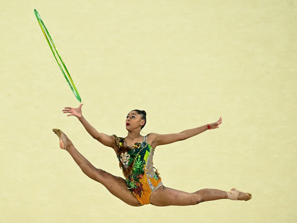 Brazil's Barbara Domingos performs with the hoop as she competes in the rhythmic gymnastics' individual all-around final. Picture: Loic Venance/AFP