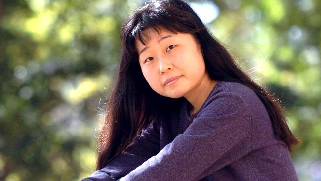 Megumi Ogawa , talks about her problems with Melbourne Uni, which may lead to her deportation , here in the grounds of Uni of QLD, StLucia , Brisbane. pic Lyndon Mechielsen 28/6/04