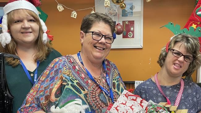 At Vinnie's Grafton St, Cairns, store, staff member, Andrea Swinburn, shop co-ordinator Kim Ward and staff member Laura Cook show some of the sensational preloved items you can buy to make your Christmas gift giving affordable and sustainable. Picture: Alison Paterson