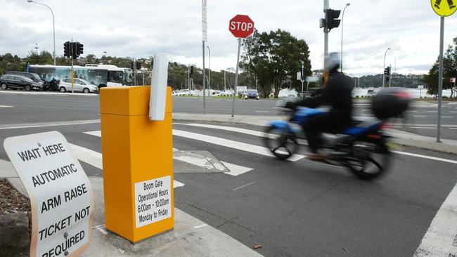 The trashed boom gate at the exit to the Spit East car park, outside Middle Harbour Yacht Club, enables northern beaches motorists to freely rat run up Parriwi Rd, Mosman to avoid Spit Rd traffic. Picture: Annika Enderborg