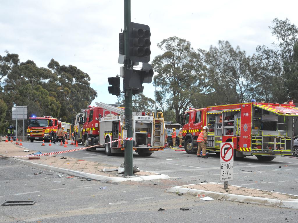 Emergency service workers at the crash on the corner of Glen Osmond and Cross roads. Picture: Roger Wyman