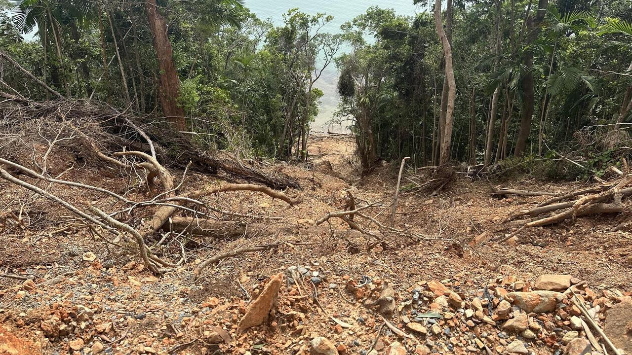 Landslides run for hundreds of metres down cliff faces and into the ocean on the Bloomfield Track between Wujal Wujal and Cape Tribulation.