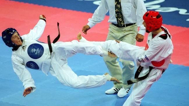 Paul Lyons (left) takes on Morocco’s Vounes Sekkat during the Sydney 2000 Olympic Games. Picture: Scott Radford Chisholm.