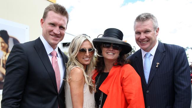 Nathan Buckley with wife Tania and Danny Frawley with wife Anita at the races in 2009.