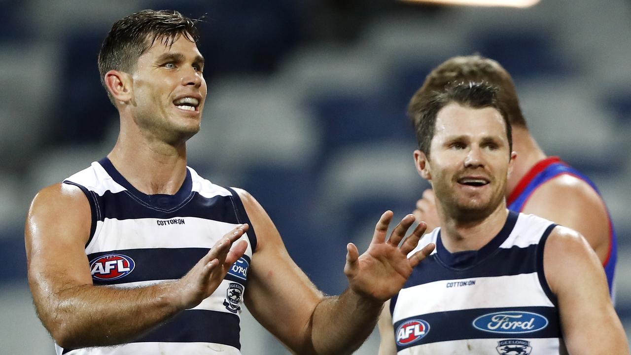 Tom Hawkins was treated for a neck injury but played out the game. Picture: Dylan Burns/AFL Photos via Getty Images