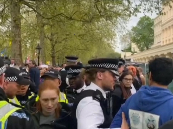 The arrest of ex-pat Australian woman Alice Chambers, who has lived in London for years, was captured by Sky News. Picture: Supplied