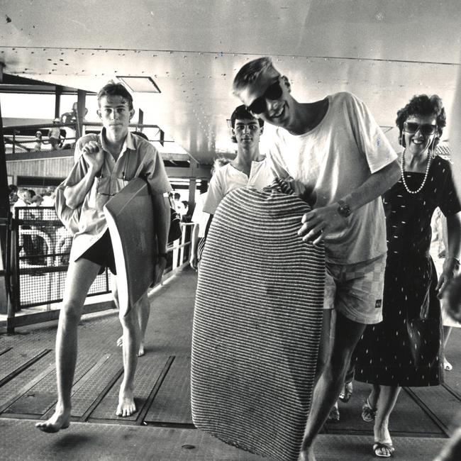 Young boogie board riders arrive at the Manly ferry terminal for a day at the beach in 1988. Picture: Simon Bullard