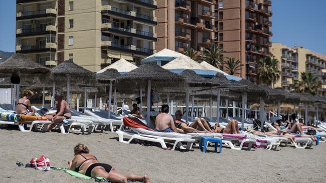 People sunbathing and enjoying the beach on May 24, 2021 in Fuengirola, Spain. Picture: Getty