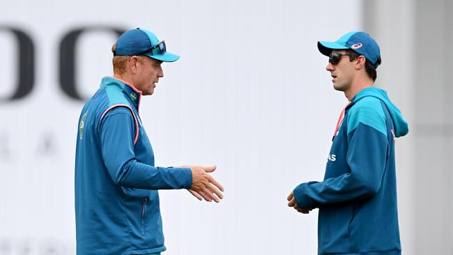 Australia’s brainstrust of coach Andrew McDonald (L) and captain Pat Cummins talk plans ahead of day four. Picture: Getty