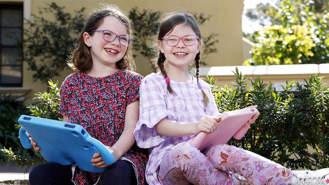 Georgie Payne and Clementine Schofield, both aged seven, need to wear glasses. Picture: Tim Hunter